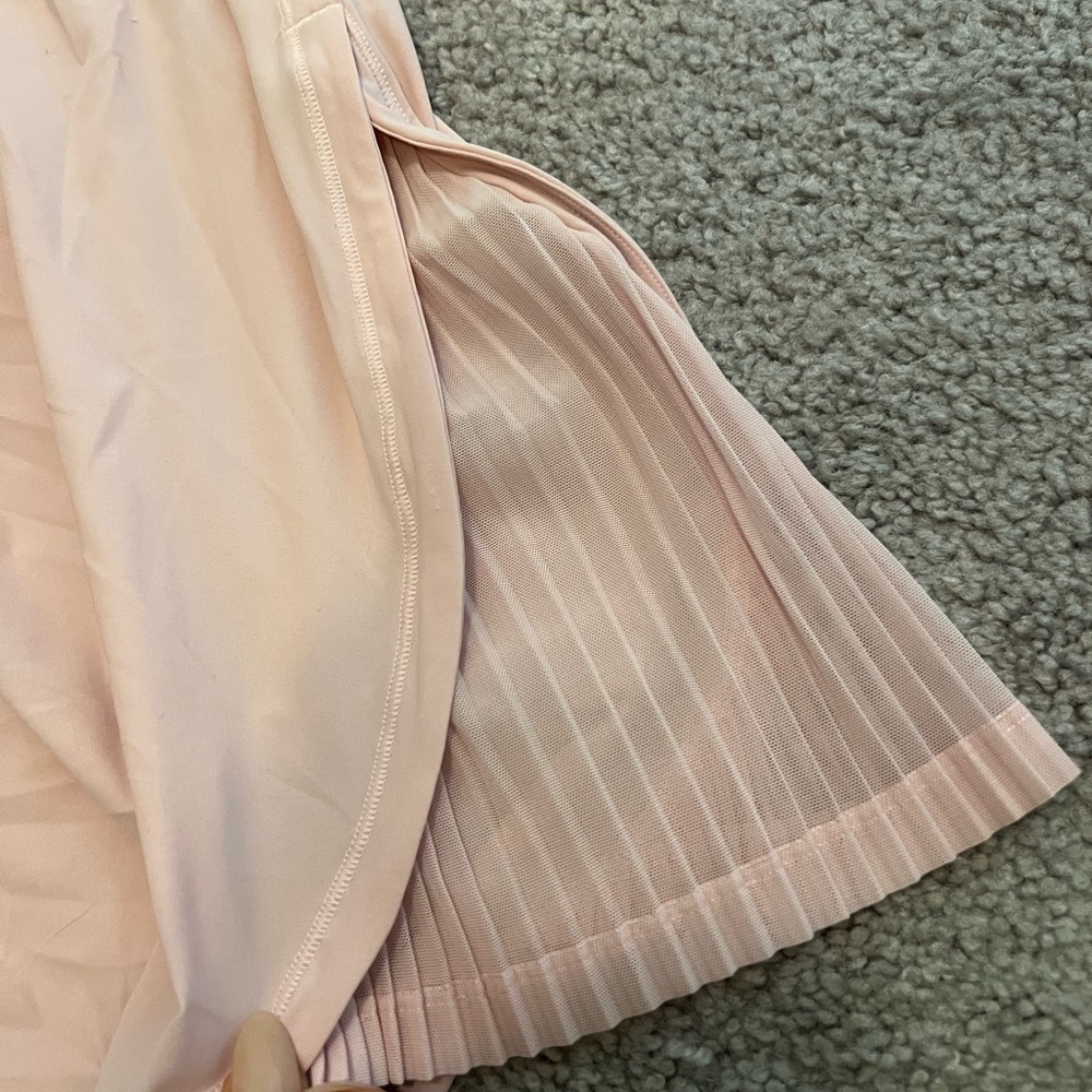 Pastel Pink Lulu lemon shirt with ruffled sides